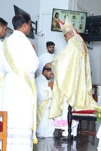 07. Bishop laying hands on Dn. Praveen Dandavati .JPG