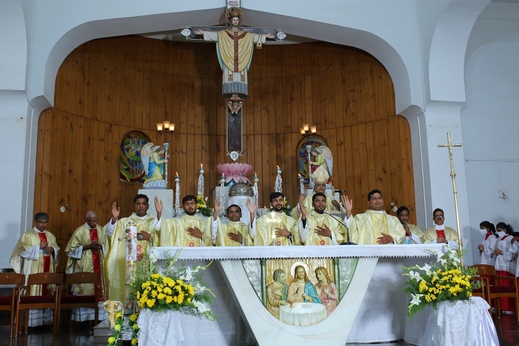 11. Newly ordained priests giving final blessing during the Mass